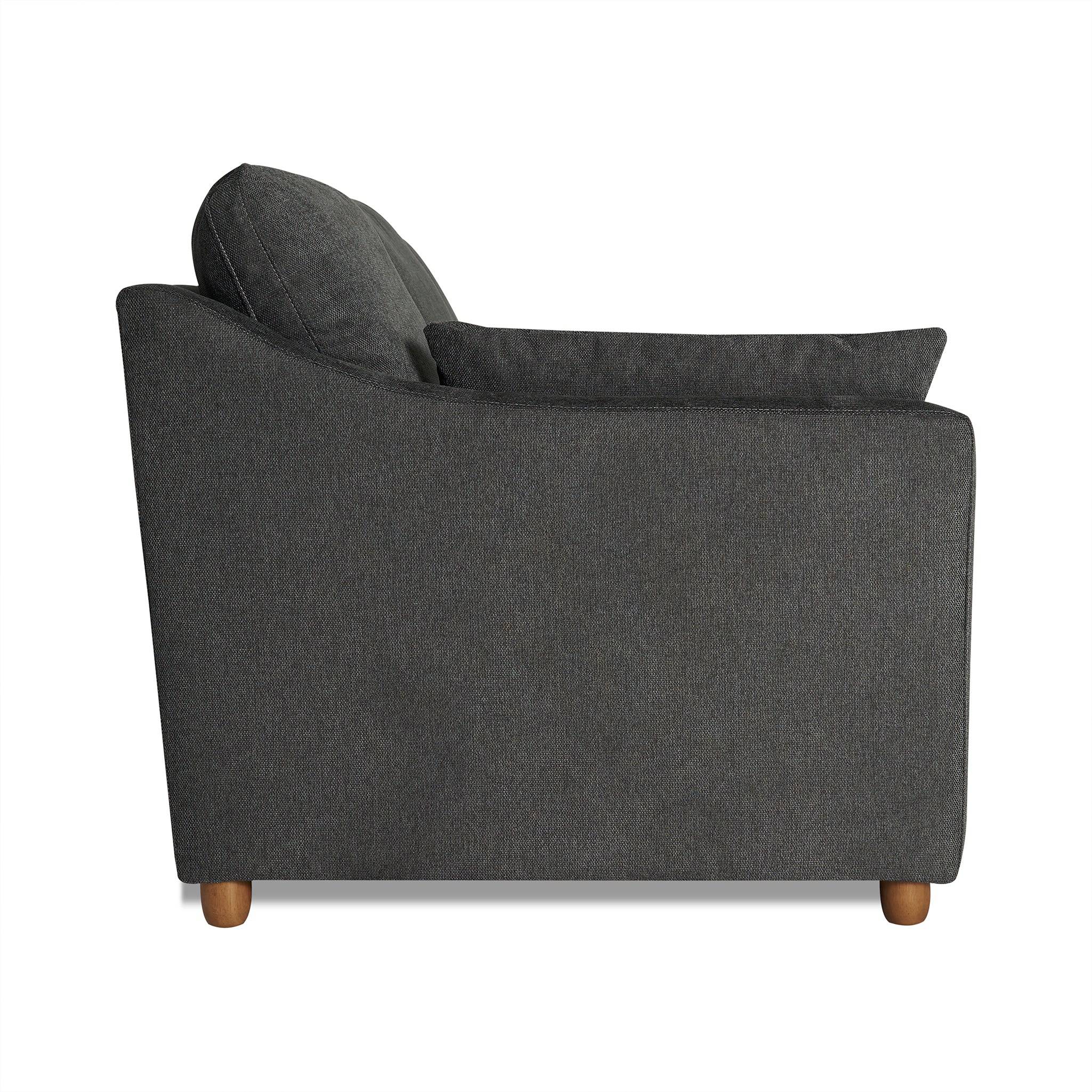 Side view of the My Cloud Slope Sofa in dark gray, showcasing a cushioned backrest and seat. This customizable piece features a clean, modern design with machine-washable covers and small round wooden legs.