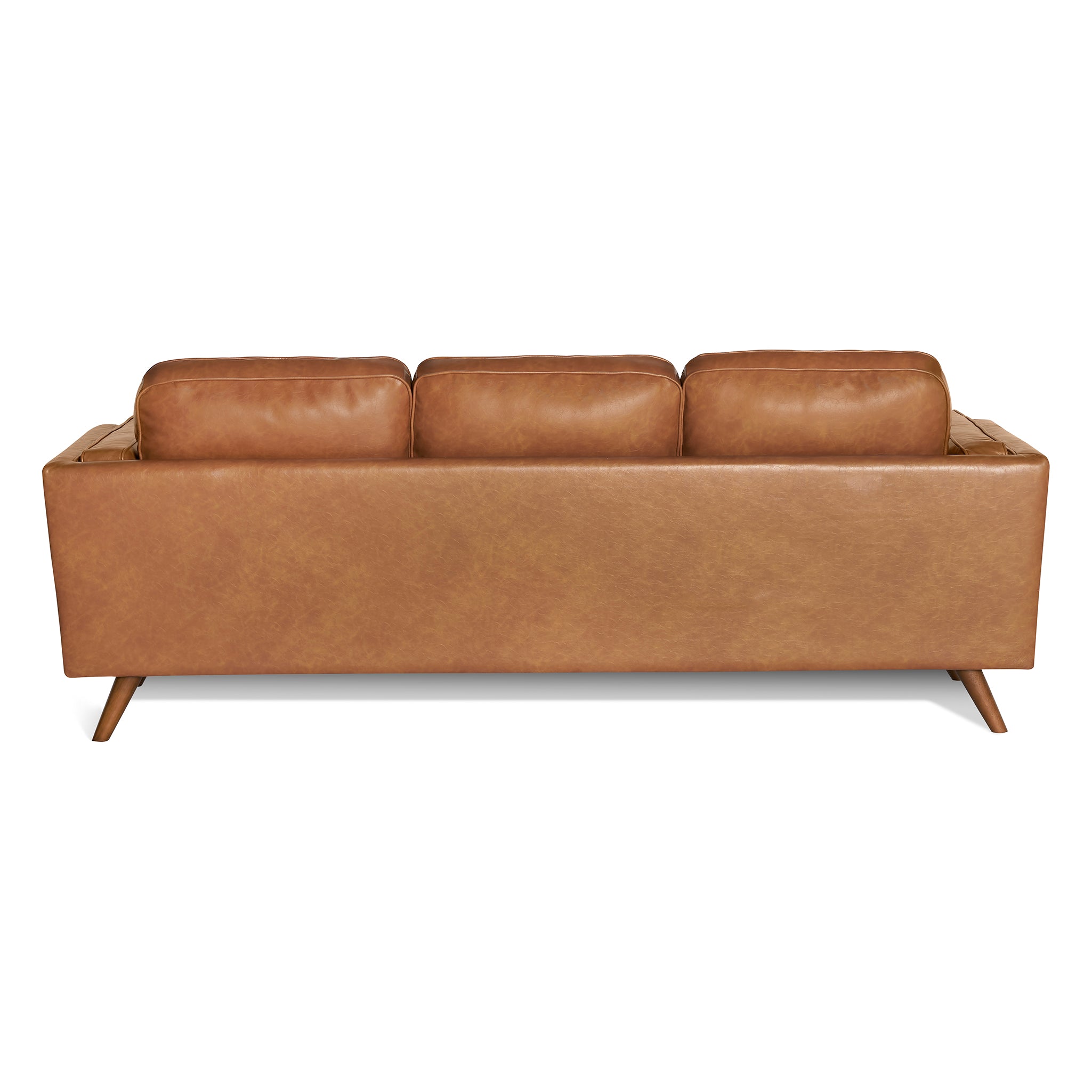 The Maddox Sofa is shown from the back, highlighting its modern brown leather design with three plush cushions and tapered wooden legs, all set against a crisp white background.