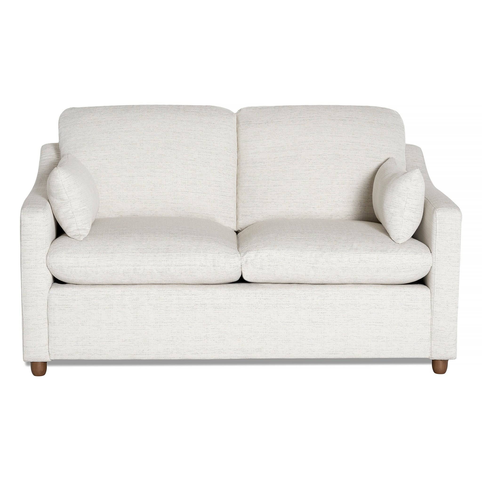 The cream-colored My Cloud Slope Loveseat features simple, clean lines with cushioned seats, two back cushions, and matching throw pillows. Its supported by four round wooden legs and exemplifies durable style and comfort.