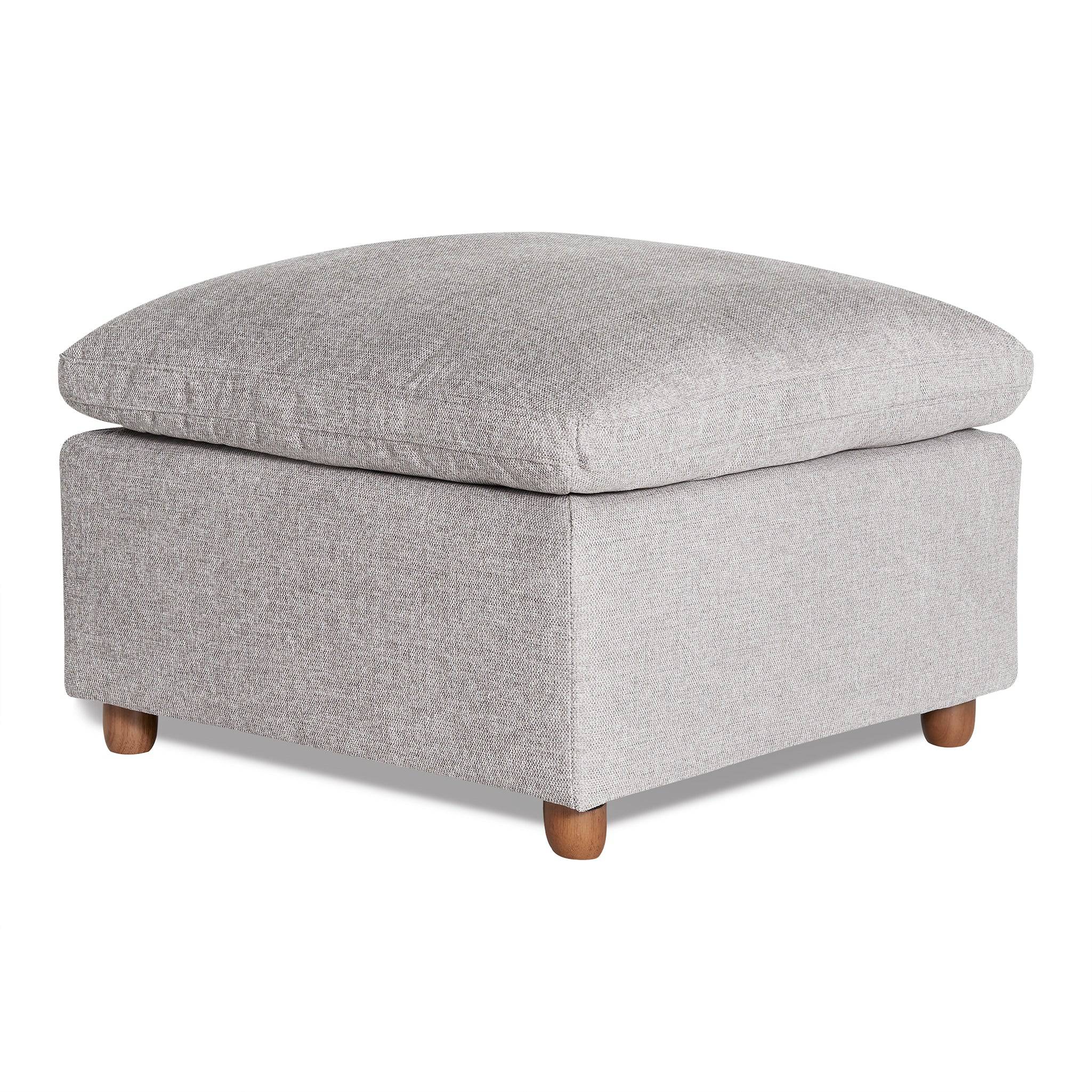 The My Cloud Slope 30 Ottoman, featuring a square design in light gray fabric with a cushioned top and wooden legs, offers comfortable furniture. Its simple, modern style is ideal for living room decor.