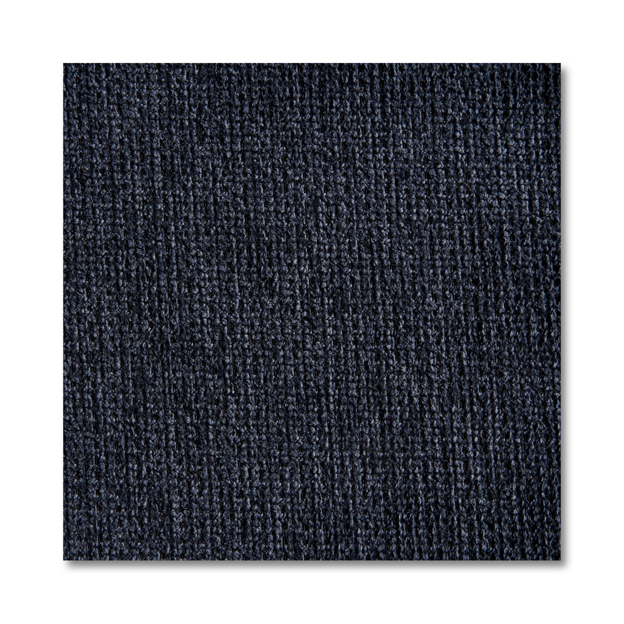 Close-up of a dark blue textured carpet tile with vertical ribbed patterns, reminiscent of the design in My Cloud 4 Piece Straight. The square tile, resembling machine-washable fabric sections, stands out against a white background, highlighting its detailed fibers.