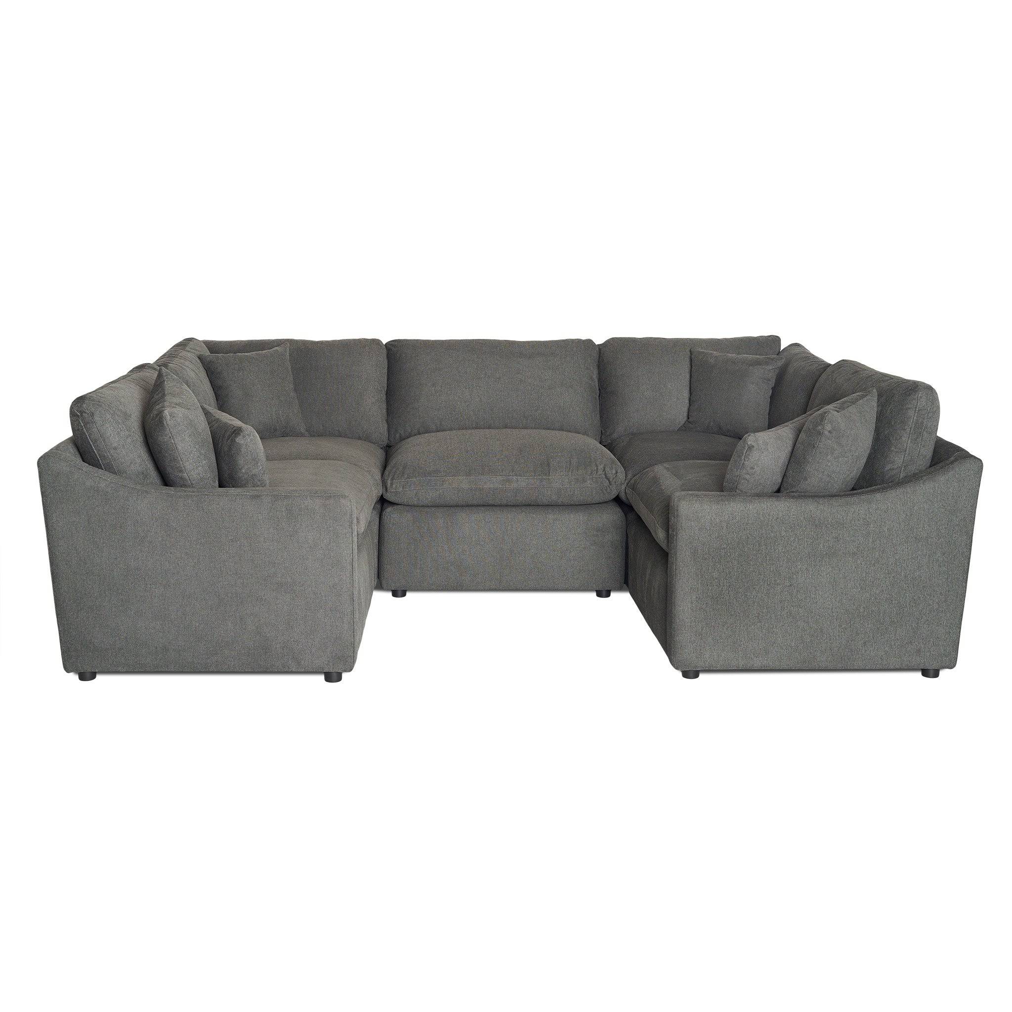 The My Cloud / Slope Arm is a large, gray U-shaped sectional sofa with a textured fabric finish. It provides comfort and style, boasts multiple cushions for seating and back support, and offers a modern and spacious look thats perfect for any living room.