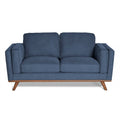 The Maddox Loveseat is a blue, mid-century modern piece with square cushions, wide armrests, a sturdy wooden base, and angled legs for durability and contemporary style.