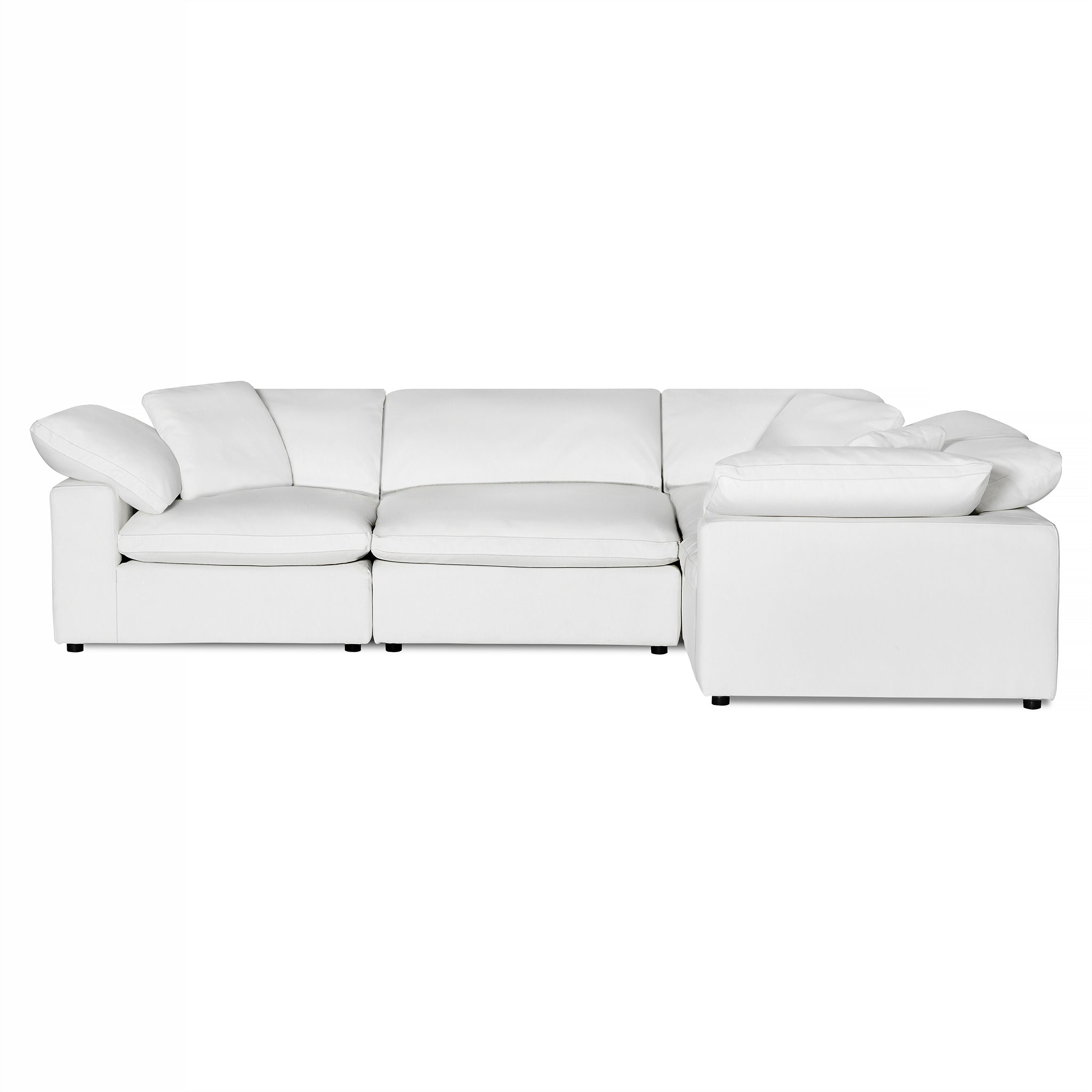 The Peyton is a white sectional sofa featuring plush cushions and a minimalist design. Its connected segments offer modern comfort and a clean look, blending seamlessly into contemporary living spaces with versatile appeal.