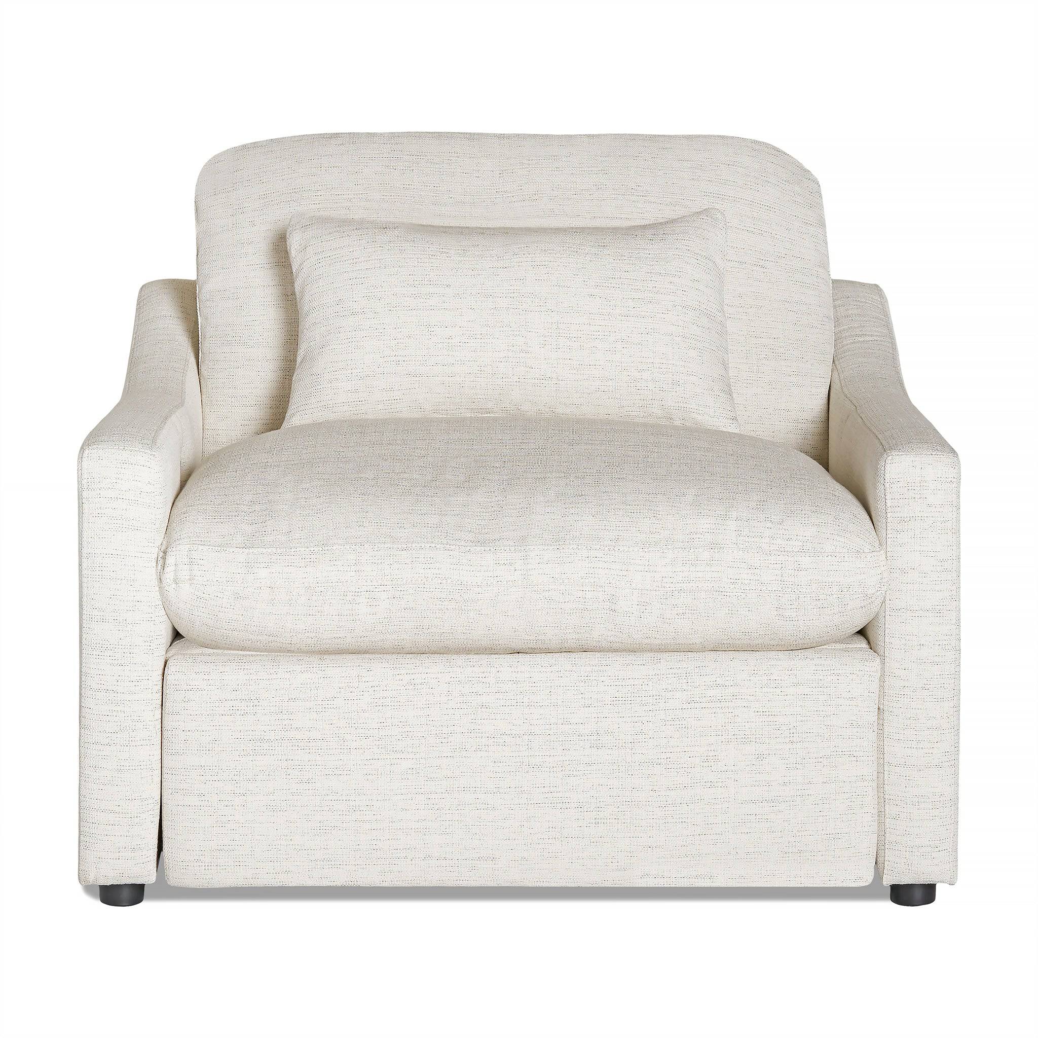 A cream-colored armchair with a matching pillow from My Cloud Slope Power Recliner graces the room. It features a plush, cushioned look with a slightly curved backrest, rectangular armrests, and subtly textured fabric for an elegant touch.