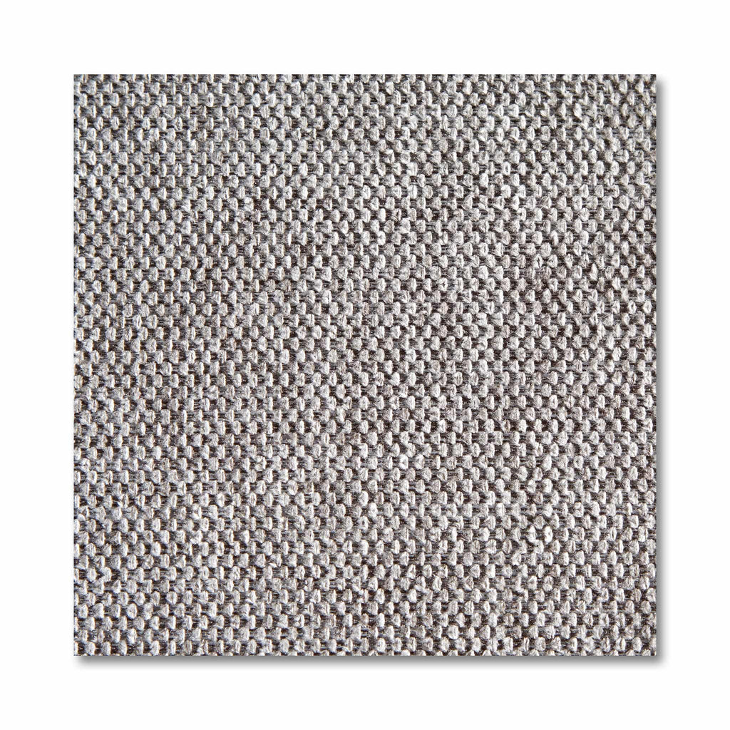 A close-up of a textured, grid-like gray fabric swatch with varying shades and a subtle woven pattern resembling the customizable My Cloud Slope Chair. The detailed surface shows shadows hinting at its soft, slightly raised texture.