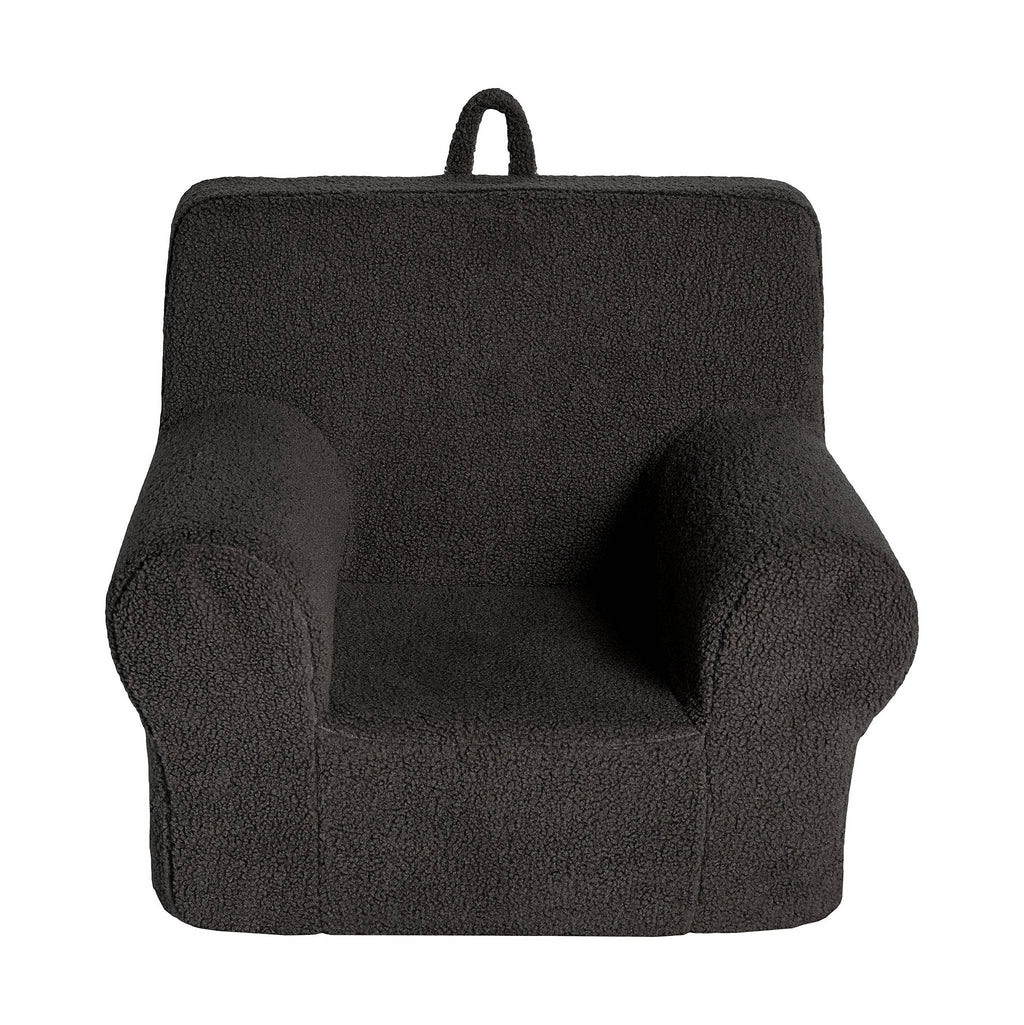 The My Cloud Kidz Chair is a dark gray childrens armchair with a soft Sherpa cover, curved armrests, and a sturdy backrest. Designed for convenience, it includes a loop handle for easy portability, ensuring its both stylish and functional in your little ones space.