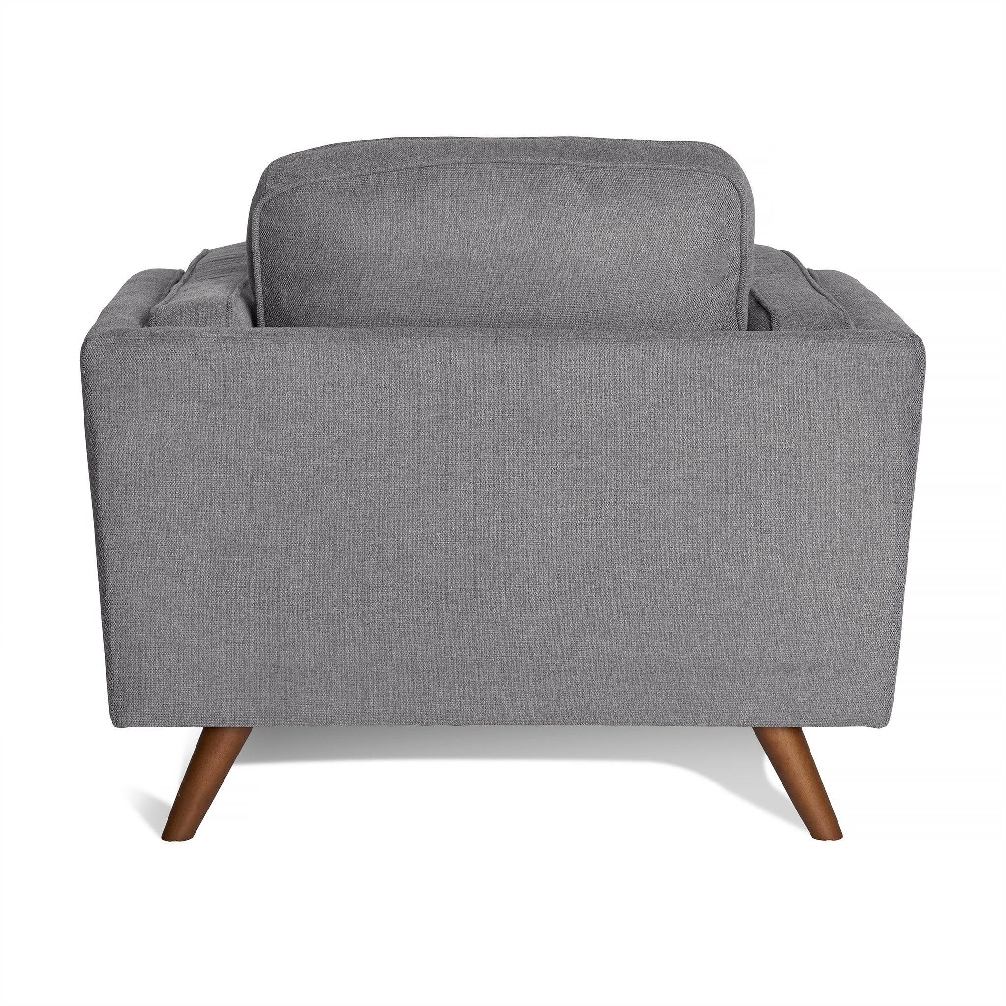 Back view of the Maddox Chair, a gray fabric-upholstered, mid-century modern armchair featuring wooden legs and plush cushions, shown against a white background.