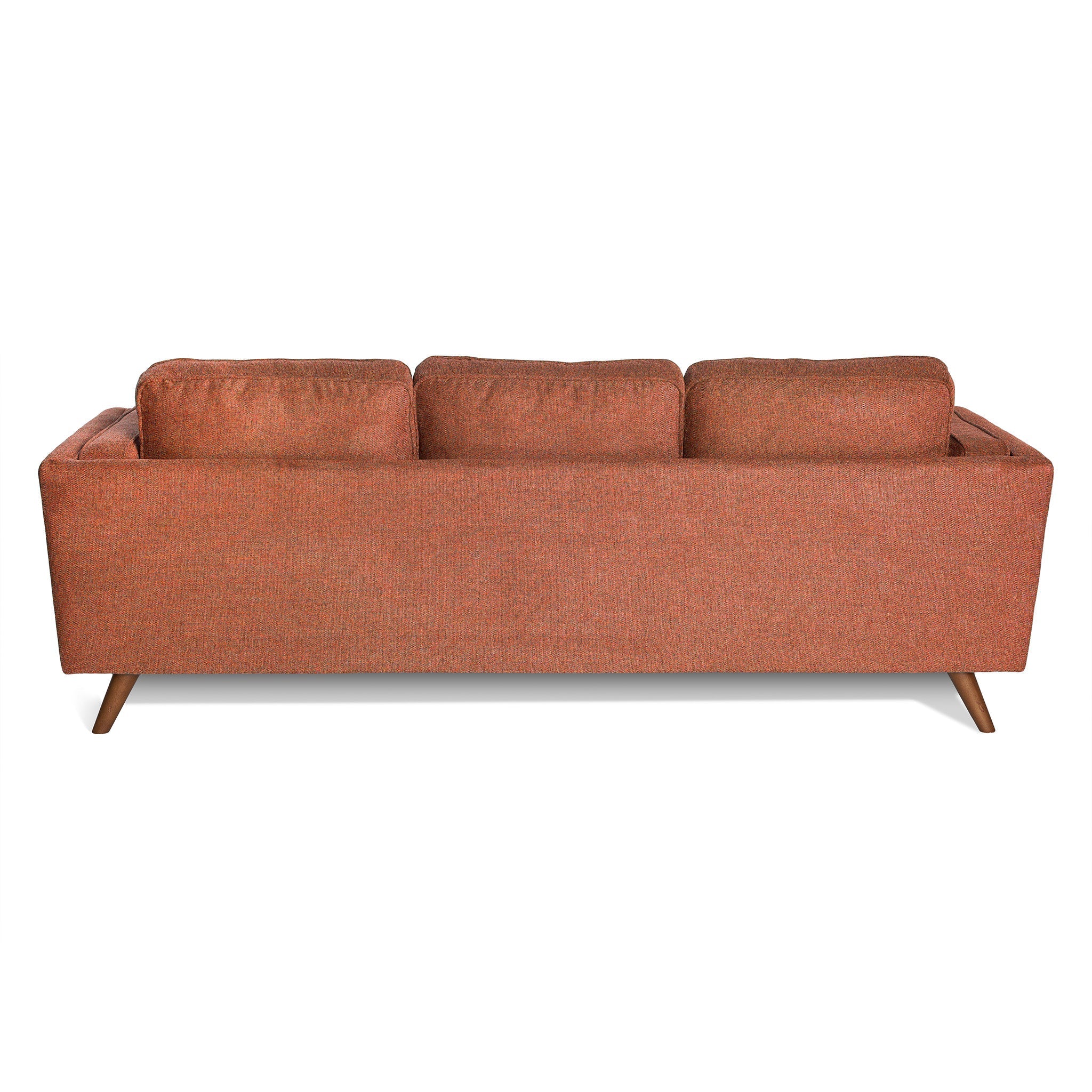 A rear view of the Maddox Sofa shows its orange hue, mid-century modern style, three plush back cushions, and angled wooden legs.